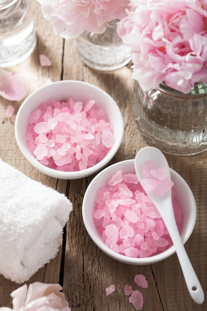 Spa set with peony flowers and pink herbal salt