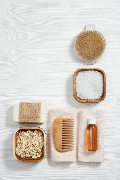 spa still life background set for body care bottles with gel and shampoo soap sea salt washcloth