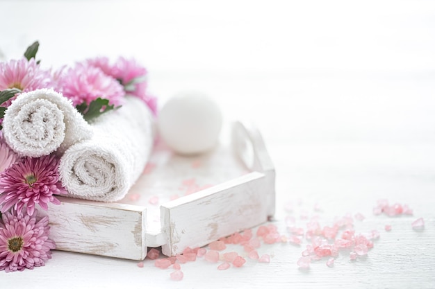 Spa still life with body care products and flowers. Hygiene, cleanliness and body care concept.