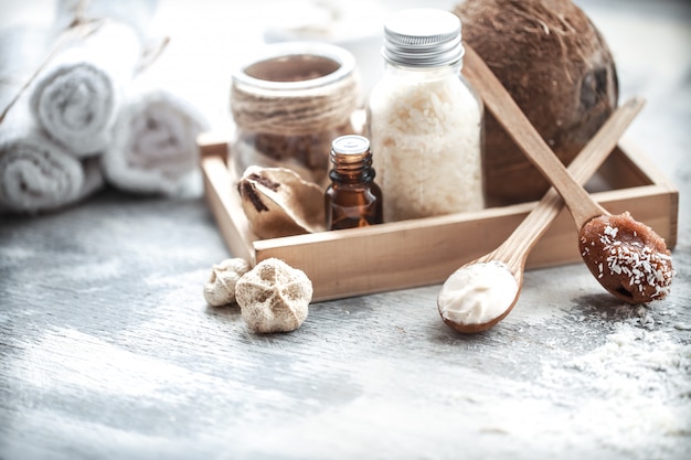 Spa still life with fresh coconut and body care products