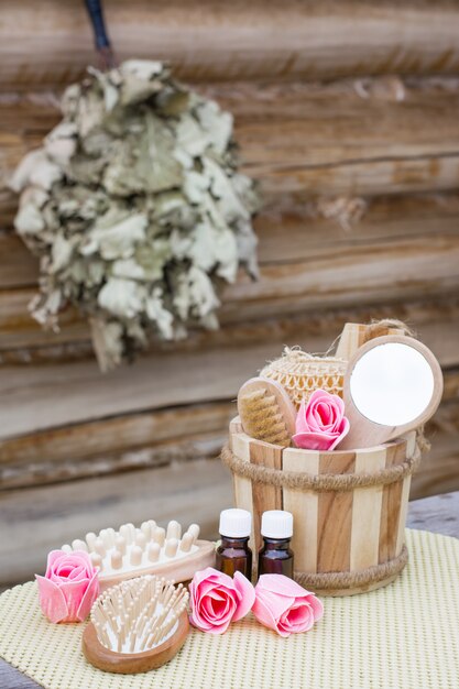 Spa still-life with objects for swimming against the background of a wooden log house