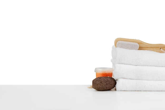 Spa still life with stacked of stone and towel isolated on white