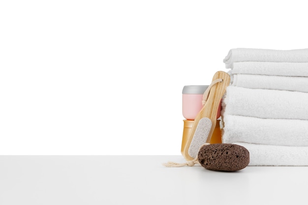 Spa still life with stacked of stone and towel isolated on white