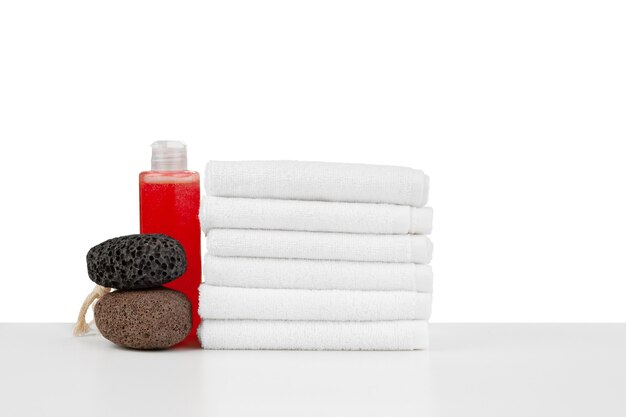 Spa still life with stacked of stone and towel isolated on white