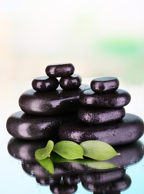 Spa stones on bright background