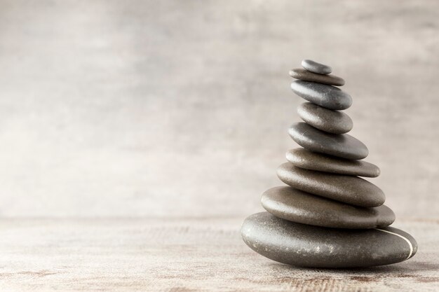 Spa stones on the grey table.