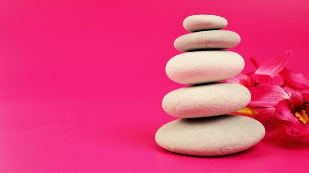 Spa stones massage relax treatment, Stone cairn on striped grey white background, five stones tower, simple poise stones, simplicity harmony and balance, rock zen