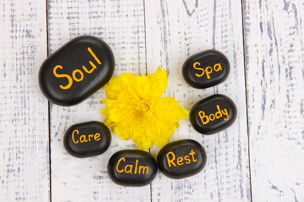 Spa stones on wooden background