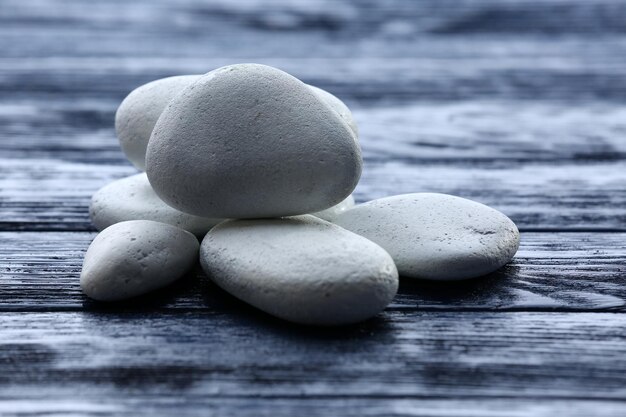 spa stones on wooden background