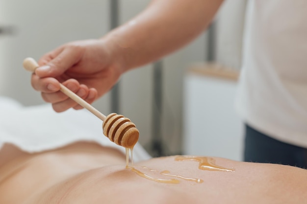 Spa treatment  woman undergoing spa treatment with honey