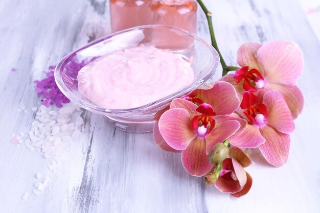 Spa treatments on color wooden background