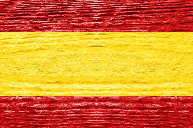 Foto spaanse vlag met houten structuur