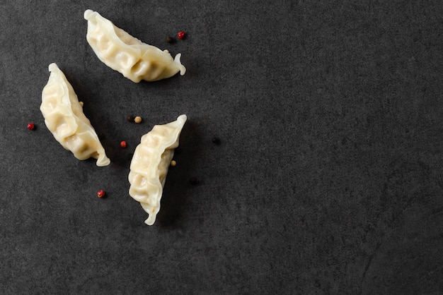 Space gyoza dumplings on dark background 