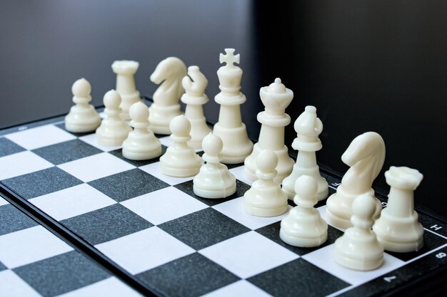 Spaced chess on a black wooden background