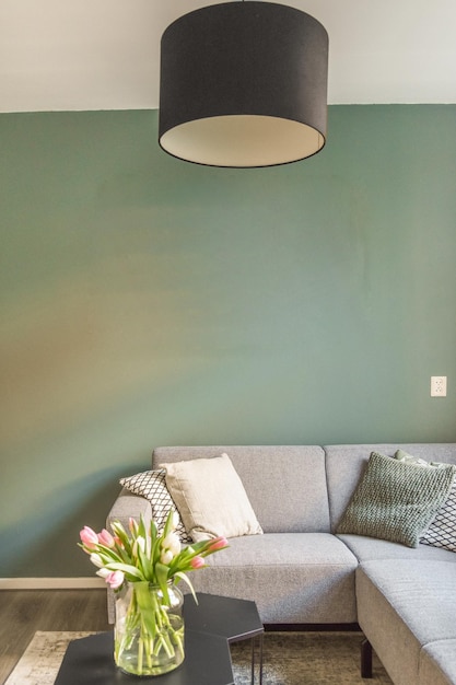 Spacious attic room with sofa and kitchen