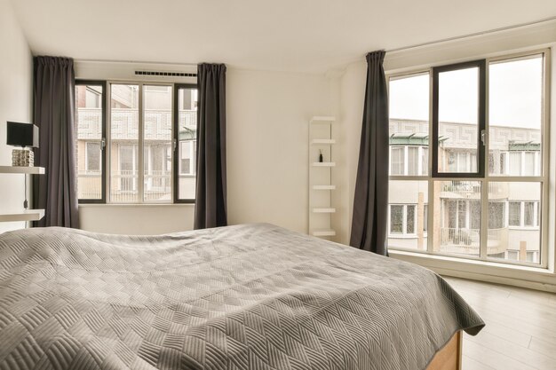 Spacious bright bedroom with a minimalist bedside table