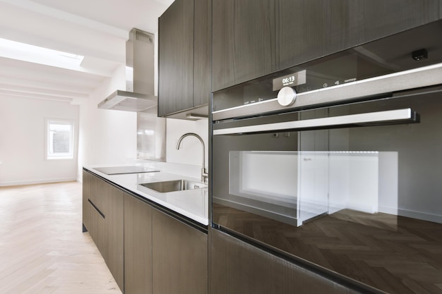 Spacious bright black kitchen with windows