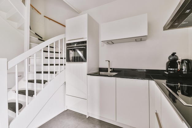 Spacious bright white kitchen with corridor