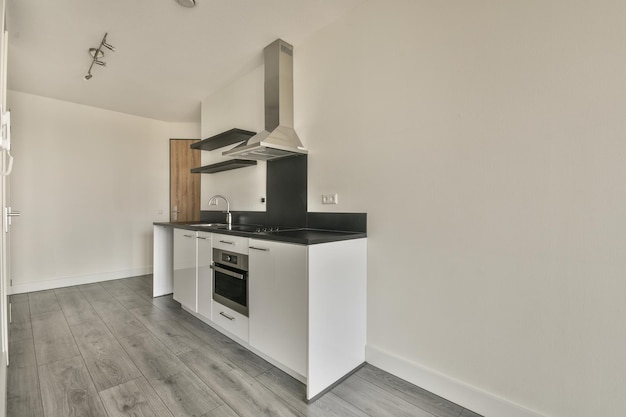 Spacious bright white kitchen with corridor