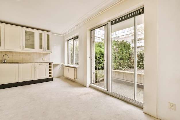 Spacious bright white kitchen with windows