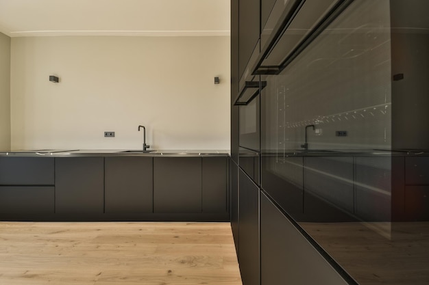 Spacious bright white kitchen with windows