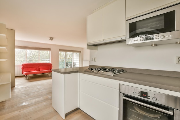 Spacious bright white kitchen with windows