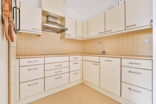 Spacious bright yellowish kitchen with windows