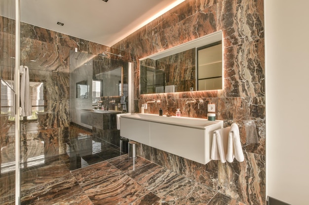 Spacious dark bathroom with shower and sink