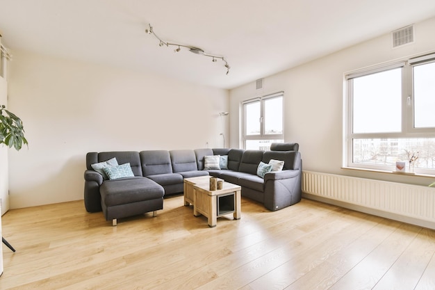 Spacious living room with black sofa