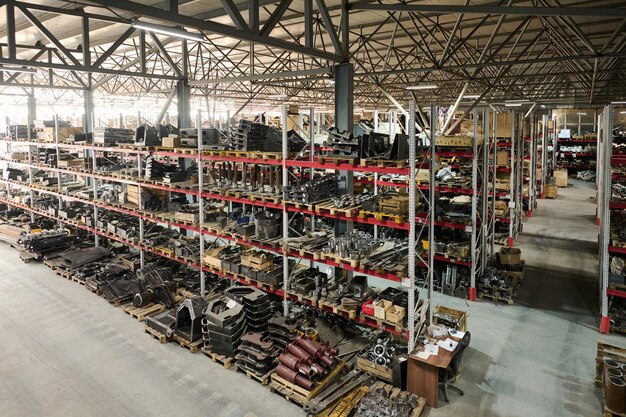 Spacious warehouse of modern industrial factory producing huge machines