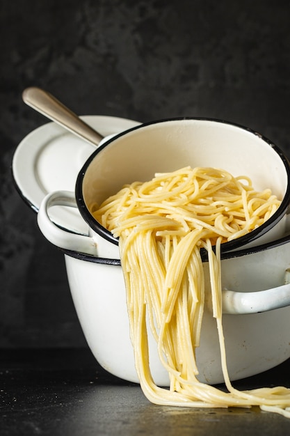 spaghetti boiled pasta pan on the stode dish italian cuisine classic on the table