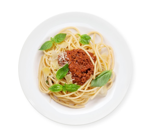 Spaghetti bolognese pasta with tomato and minced meat sauce parmesan cheese and fresh basil Top view flat lay isolated on white