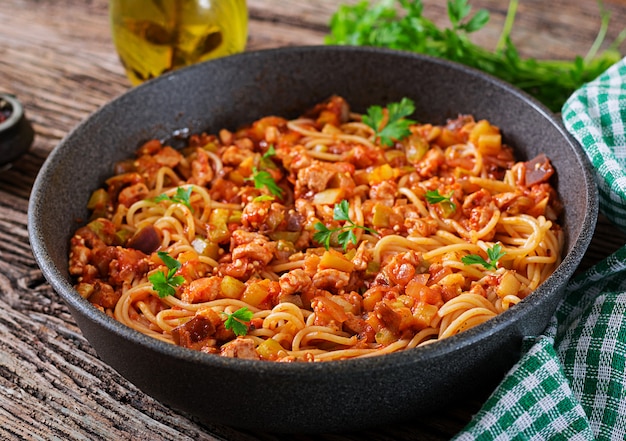 Spaghetti bolognese pasta with tomato sauce, vegetables and minced meat 