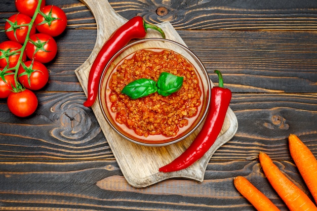 Spaghetti bolognese sauce in glass pot