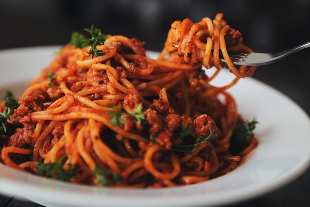 Spaghetti bolognese on wood background , italian food