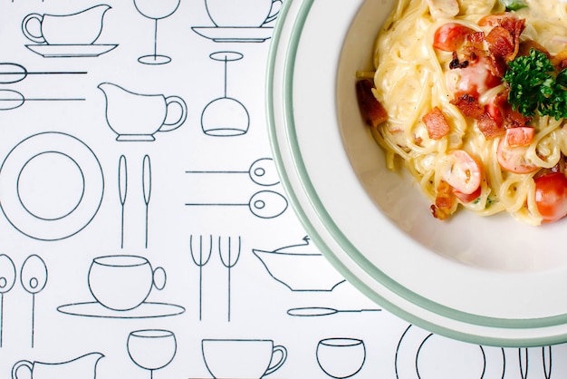 Spaghetti carbonara with fried bacon