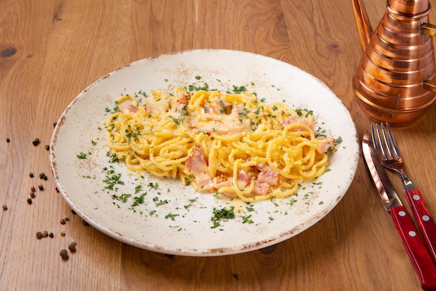 Spaghetti Carbonara on wooden table