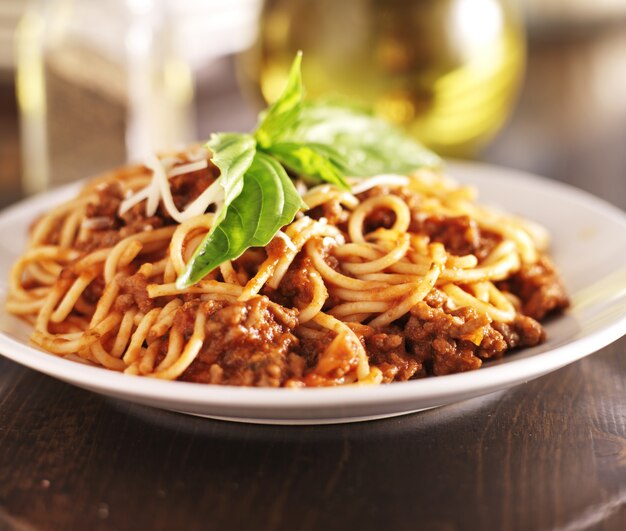 Spaghetti dinner with meat sauce and basil