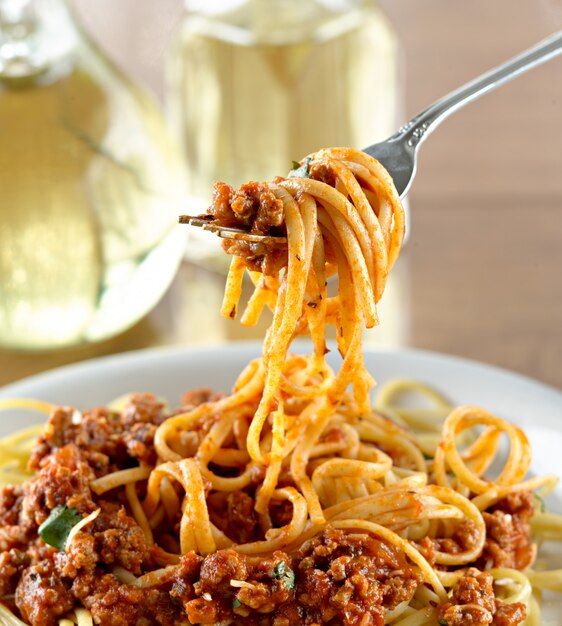 Spaghetti hanging on a fork at dinner