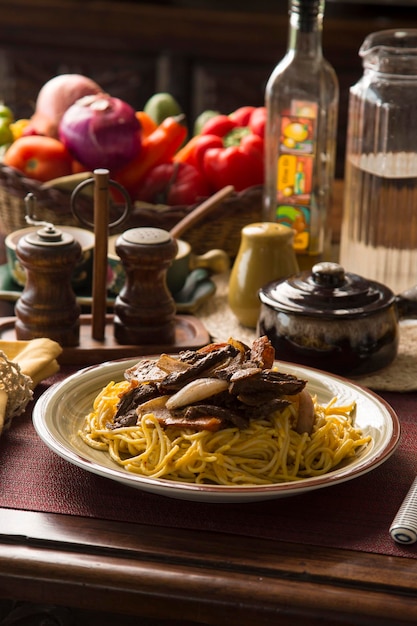 Spaghetti huancaina sauce with sauted beef traditional peruvian
comfort food homemade cuisine