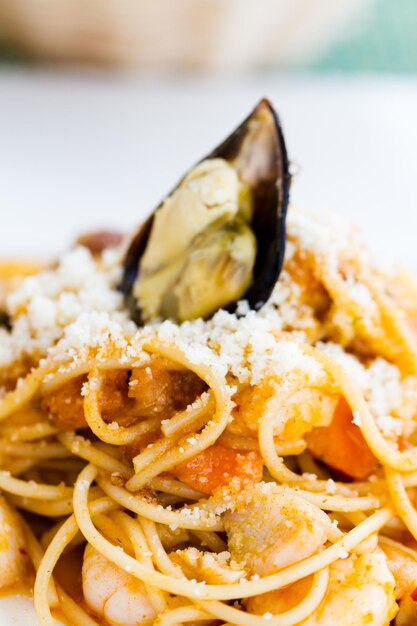 Spaghetti marina served with seafood pomodoro sauce and mix vegetables.