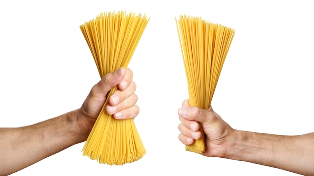 Spaghetti pasta in hand on isolated background raw italian spaghetti before cooking and eating itali...