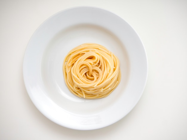 Spaghetti, pasta on plate on white background