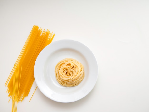 Spaghetti, pasta on plate on white background