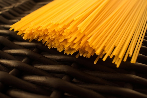 Spaghetti pasta raw black background