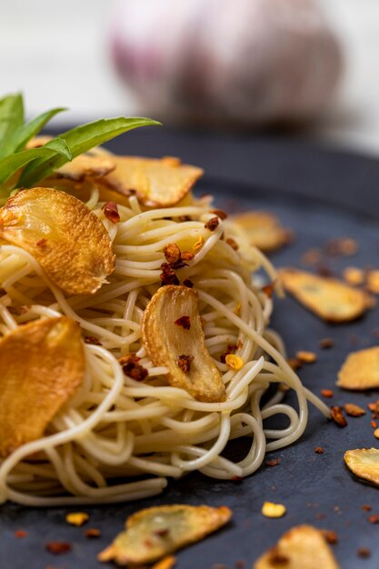 Spaghetti pasta with fried garlic and olive oil