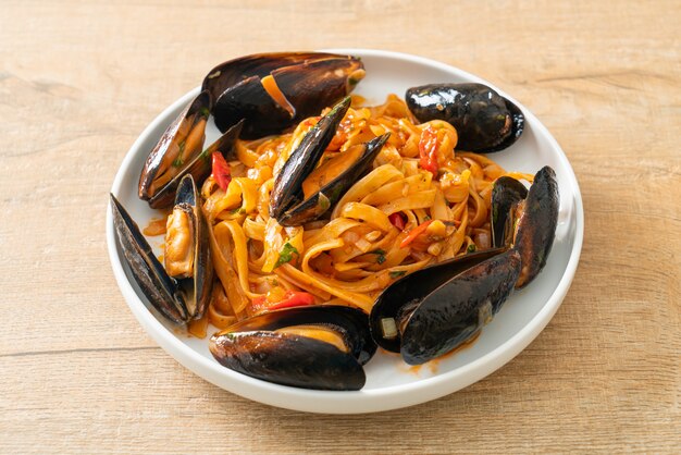 Spaghetti pasta with mussels or clams and tomato sauce - Italian food style