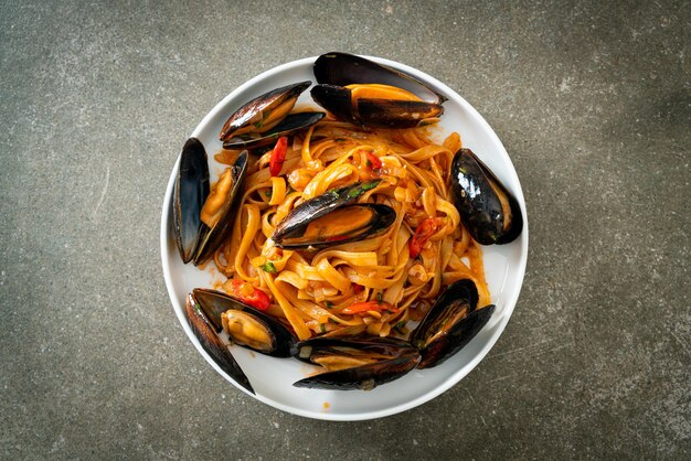 Spaghetti pasta with mussels or clams and tomato sauce - Italian food style