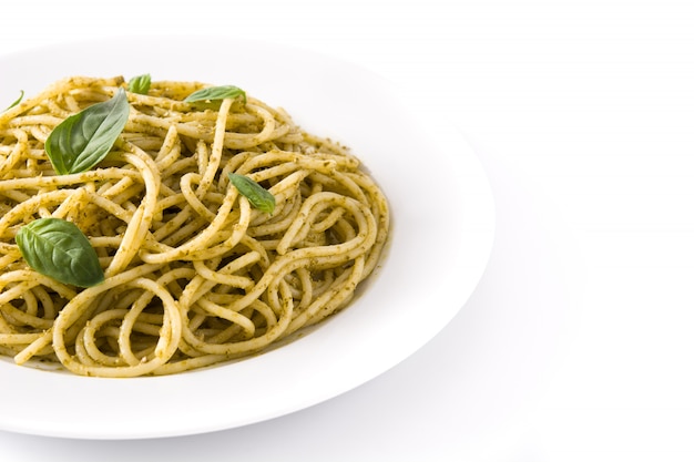 Spaghetti pasta with pesto sauce on white
