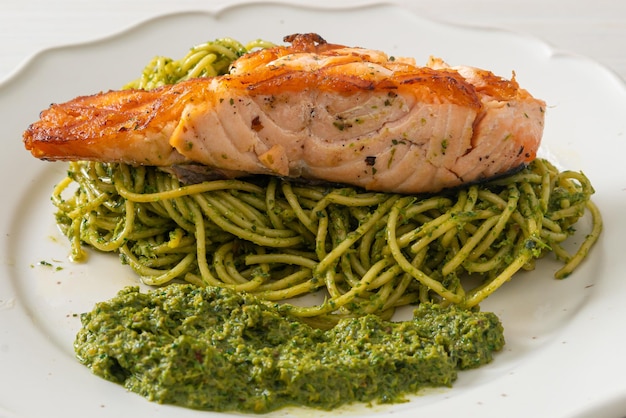 Spaghetti pesto with grilled salmon - Italian food style